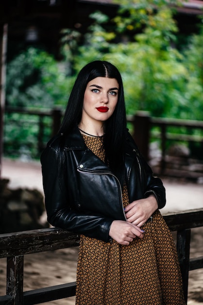 Beautiful brunette girl in a leather jacket