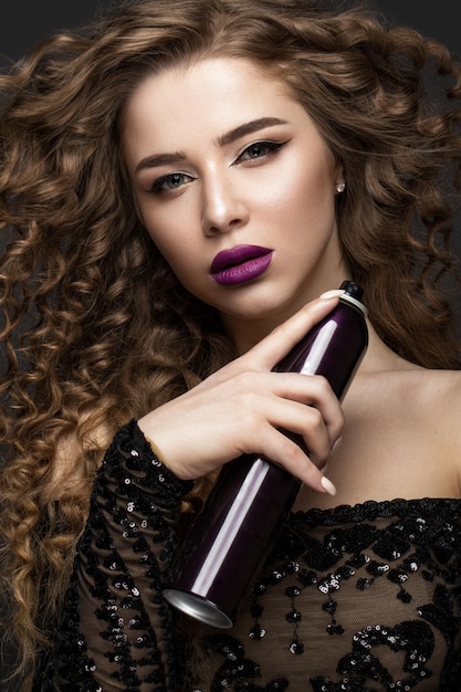 Beautiful brunette girl in move with a perfectly curly hair and classic makeup Beauty face