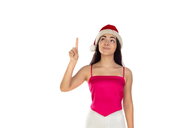 Beautiful brunette girl in santa claus hat isolated on white background with copy space