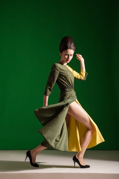 Beautiful brunette in gorgeous dress, motion shot