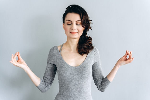 beautiful brunette meditating