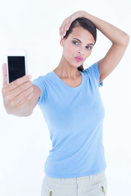 Beautiful brunette taking a selfie 