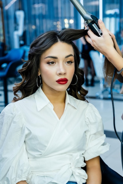 Beautiful brunette woman in a beauty salon