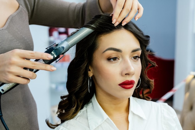 Beautiful brunette woman in a beauty salon