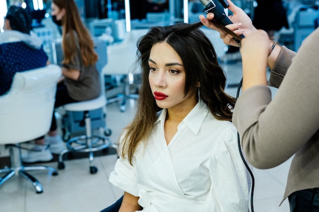 Beautiful brunette woman in a beauty salon