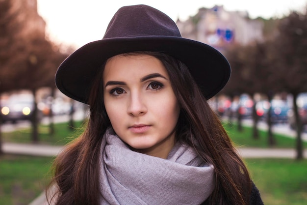 Beautiful brunette woman in hat closeup