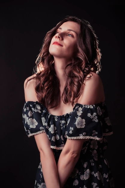 Beautiful brunette woman in a vintage dress