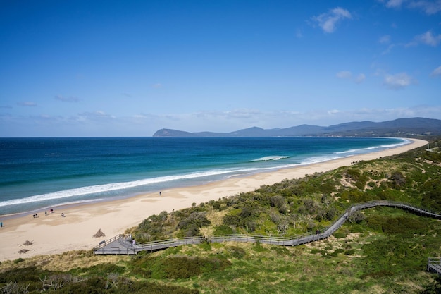 beautiful bruny island at the neck with pink clouds and the ocean below