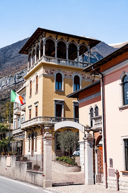 Beautiful building facade with balconies and arches como italy