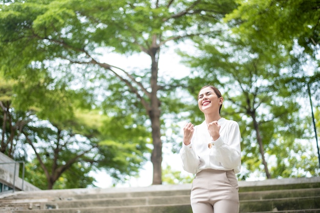 Beautiful Business  woman is successful  outdoor 