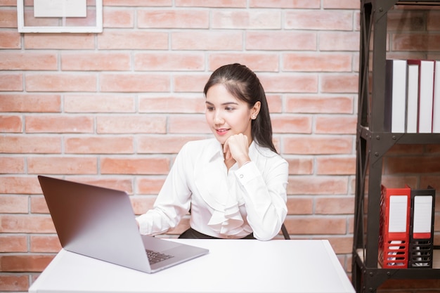 Beautiful business woman is working in office 