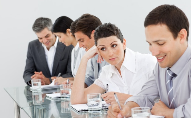 Beautiful businesswoman bored at a presentation