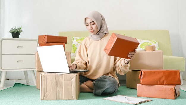 Beautiful businesswoman seriously checking customer orders in the room