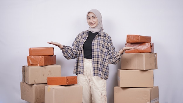 Beautiful businesswoman showing package boxes isolated on white background