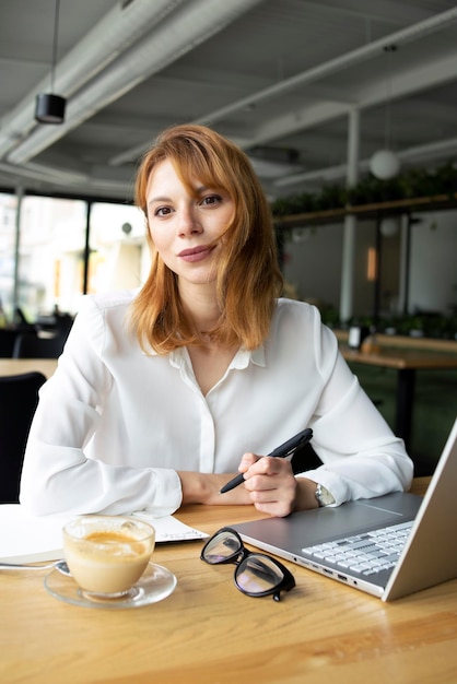 Beautiful businesswoman at the table