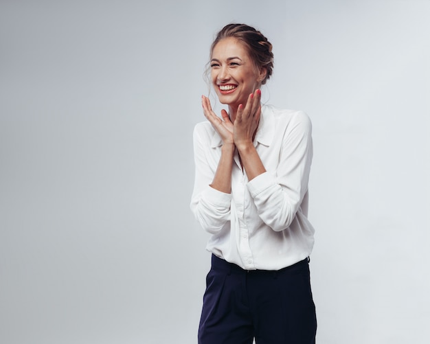 Beautiful businesswoman in white blouse and black pants