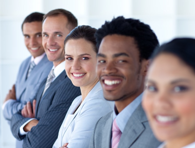 Beautiful businesswoman with her team in a line