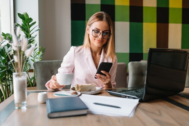 Beautiful businesswoman working at a cafe