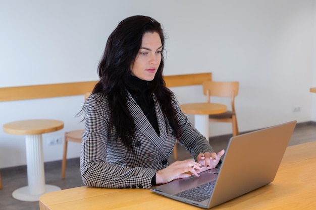 Beautiful businesswoman working on a laptop.