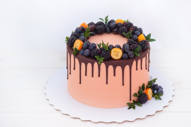 Beautiful cake with blackberries and blueberries