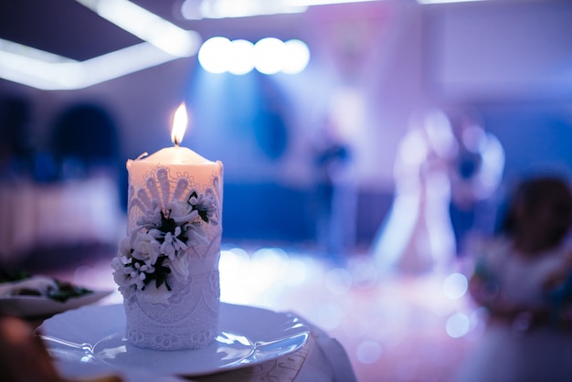 Photo beautiful candle at the wedding evening.