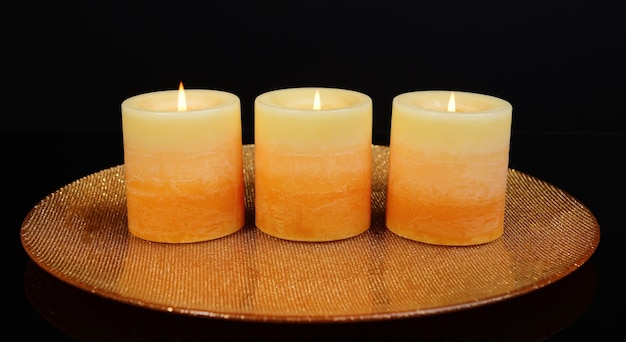 Beautiful candles isolated on black
