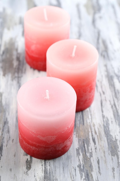 Beautiful candles on wooden background