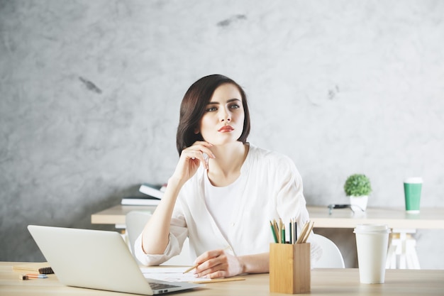 Beautiful caucasian business woman working on project