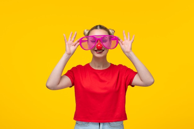 Beautiful caucasian female with funny sunglasses yellow background girl cartoon cute