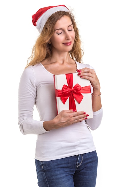 Beautiful caucasian wearing red christmas hat and holding new year gift box