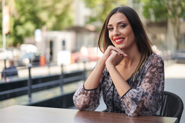 Beautiful caucasian woman sitting outdoor cafe