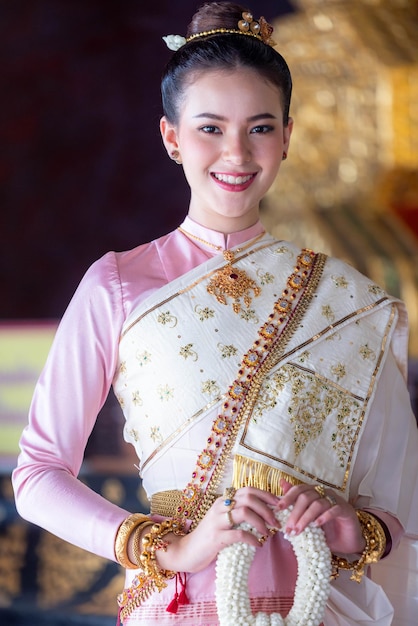 Beautiful caucasian woman in traditional Thai costume culture Beautiful asian woman Thailand