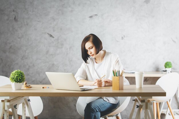 Beautiful caucasian woman working on project