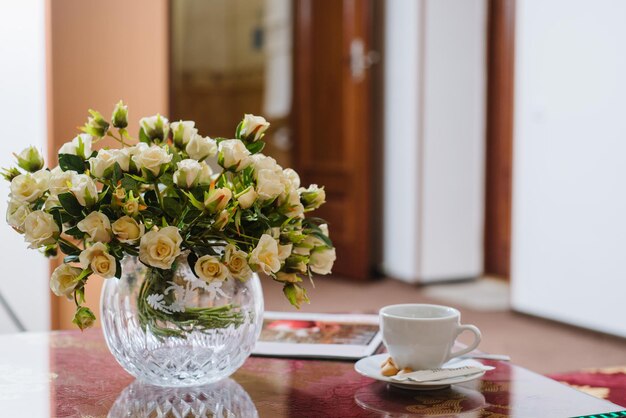 Beautiful ceramic figurine of an angel on the table on the background of the hotel room