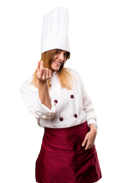 Beautiful chef woman making money gesture