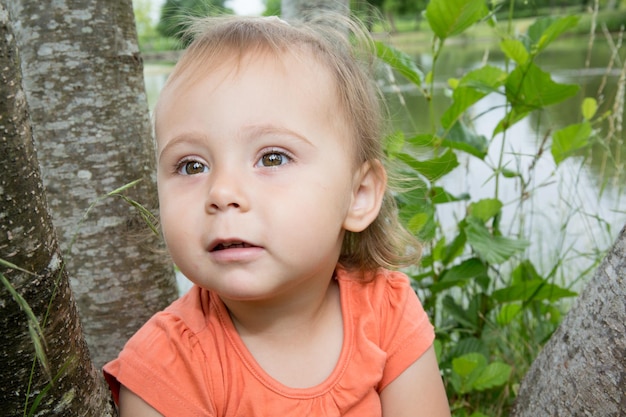 Beautiful child on the flower meadow