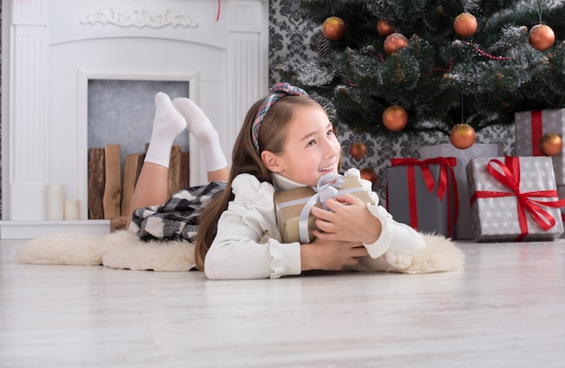 Beautiful child girl in christmas interior