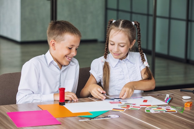 Beautiful children are students together in a classroom at the school receive education happy