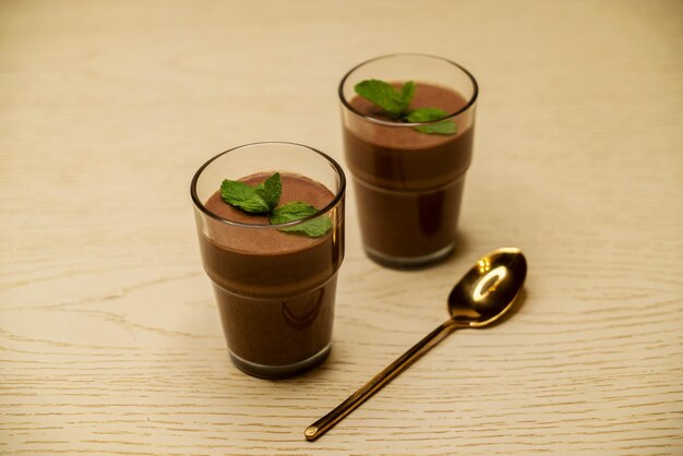 Beautiful chocolate mousse in a glass on the table