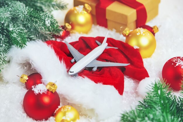 Beautiful Christmas background with airplane. Selective focus. Celebration.