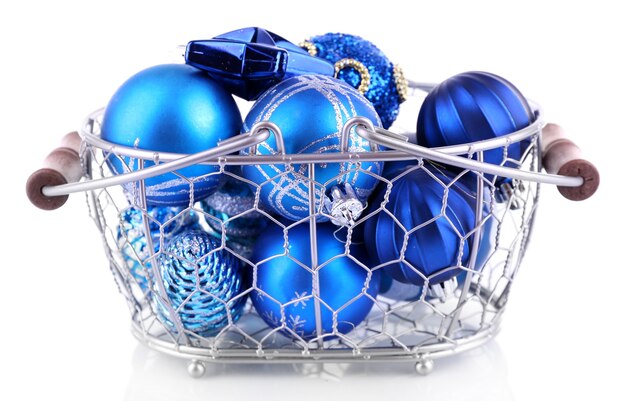 Beautiful Christmas balls in metal basket isolated on white