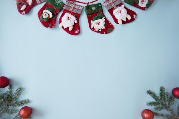 Beautiful Christmas composition on blue background Christmas socks fir spruce branches