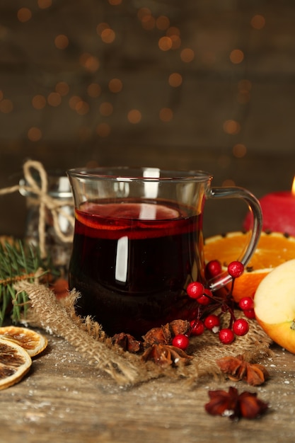 Beautiful Christmas composition of mulled wine on decorated wooden table, close up