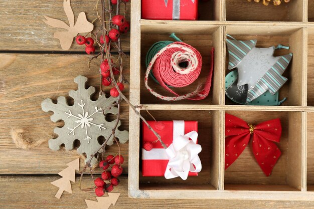 Beautiful Christmas composition with gifts in wooden crate