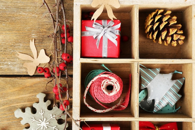 Beautiful Christmas composition with gifts in wooden crate