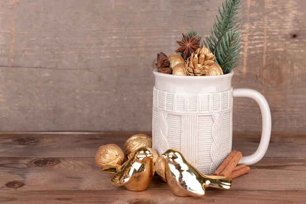 Beautiful christmas composition with golden walnuts, on wooden table