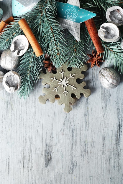 Beautiful Christmas composition with silver walnuts, on wooden table