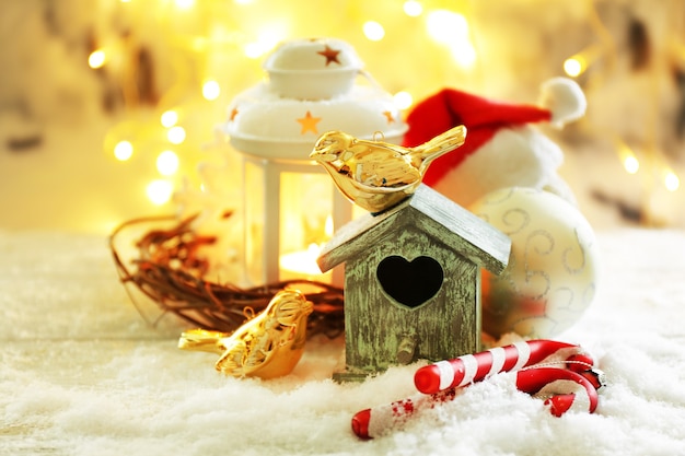 Beautiful Christmas composition with small bird house