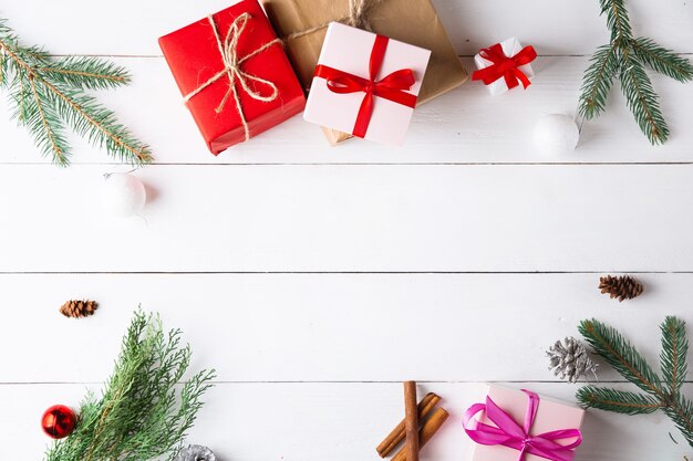 Beautiful Christmas composition on wooden white background with Christmas gift boxes. New Year.