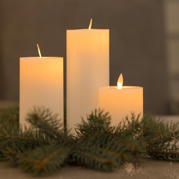 Beautiful Christmas decorations. Candles and a spruce branch